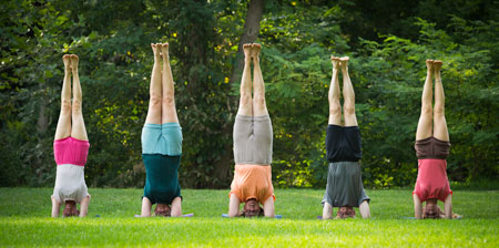 photo of 5 people doing headstand